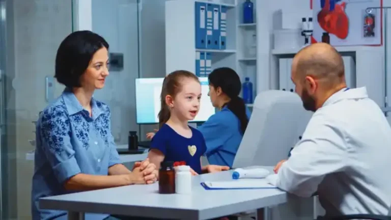 A doctor checking a little girl’s pulse 